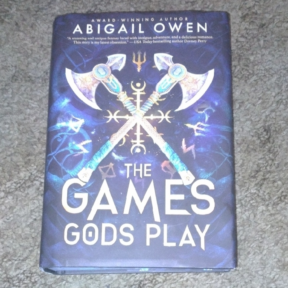 's The Games Gods Play - Blue Hardcover